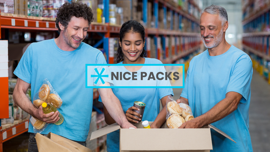 supermarket employees placing product in box