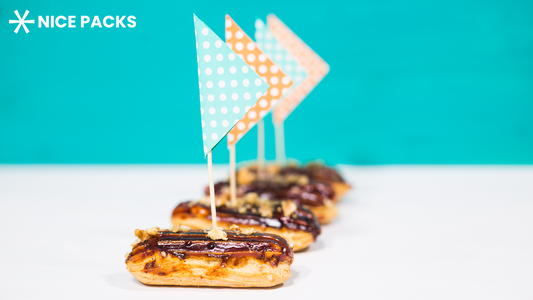 hotdogs with bbq sauce and flags on top
