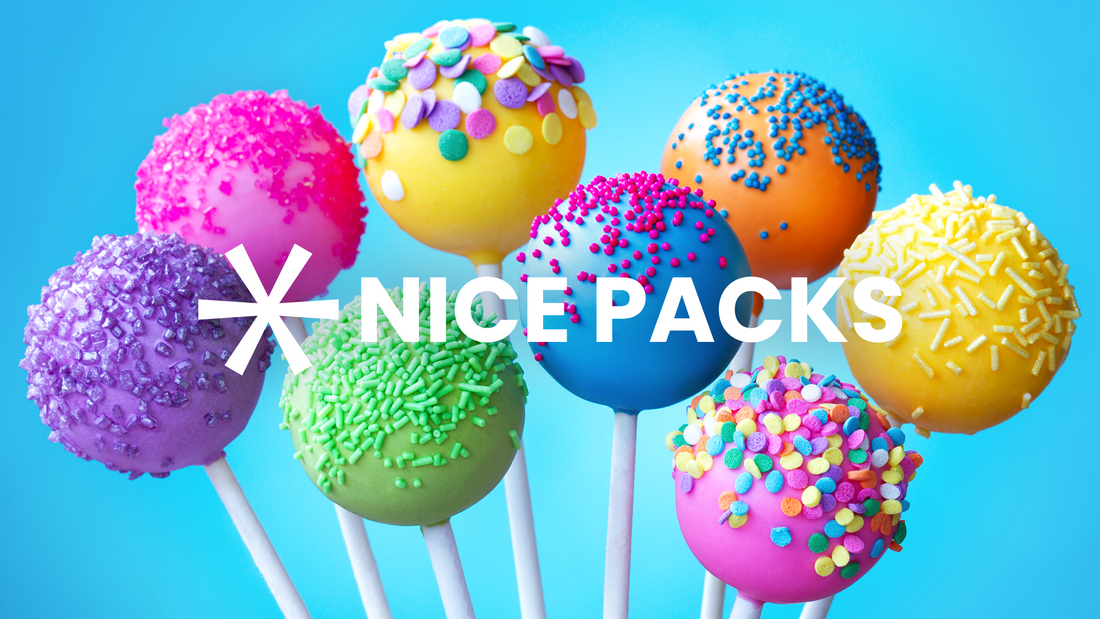 cake pops of different colors with blue background 