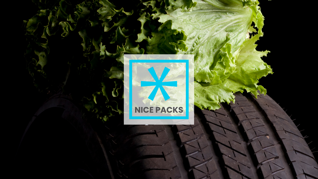A head of lettuce on a black car tyre