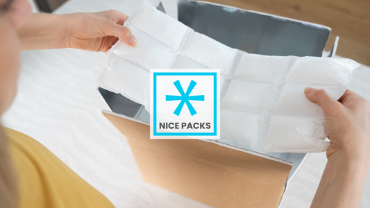 A dry ice block being held above a shipping box