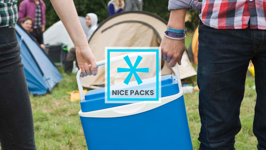 Two people carrying a blue cooler between them